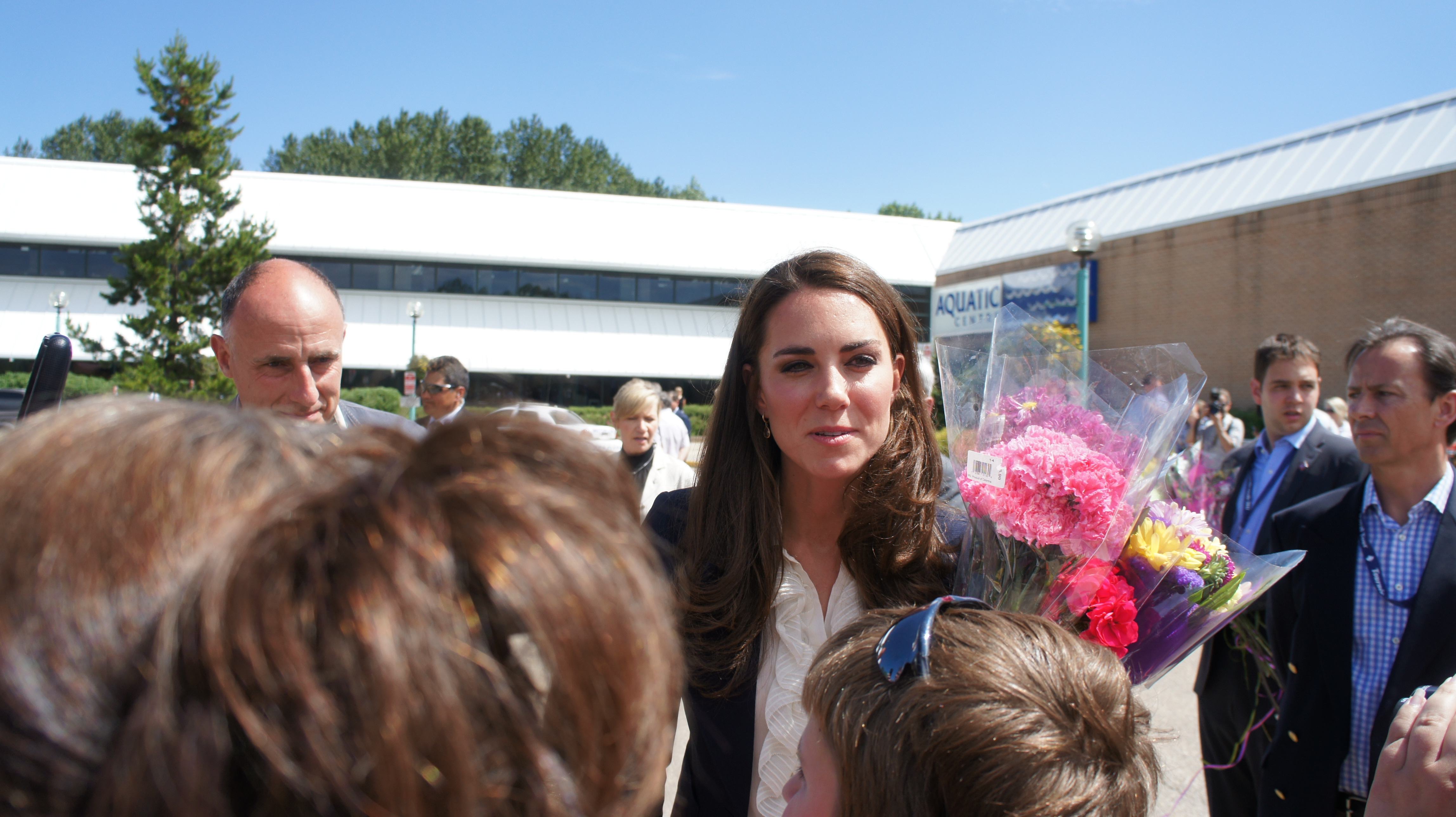 Duchess chats with Red Cross volunteer.