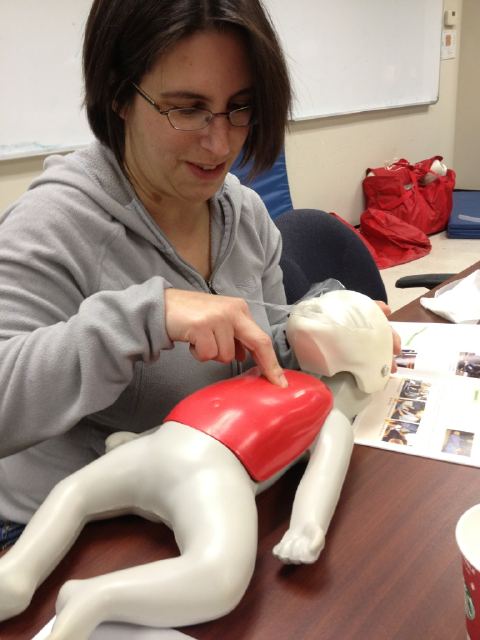 Tamara Stecyk practices infant CPR at Edmonton tweetup.