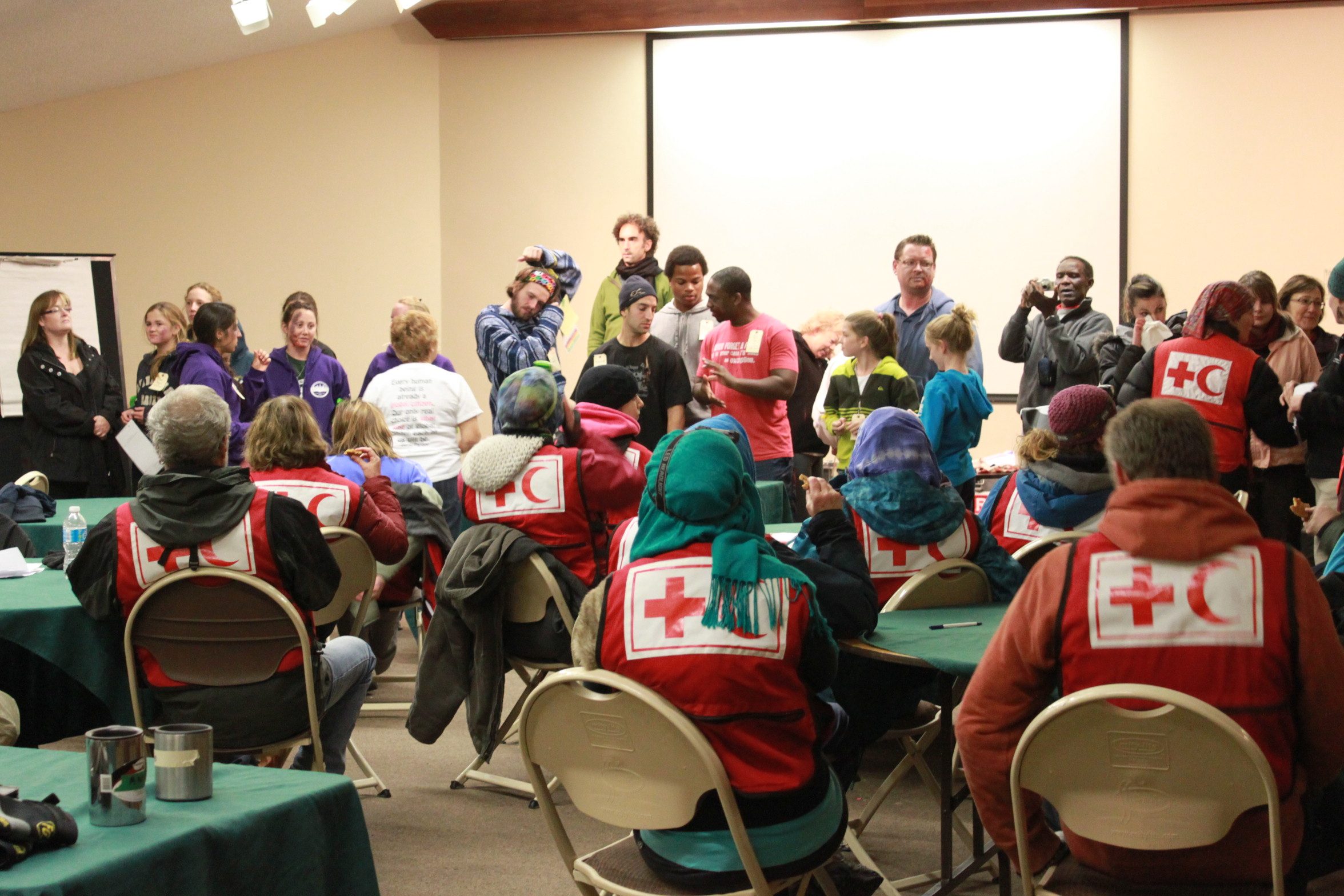 When the training exercise is finished, the Red Cross delegates meet the volunteers before they have a full debrief