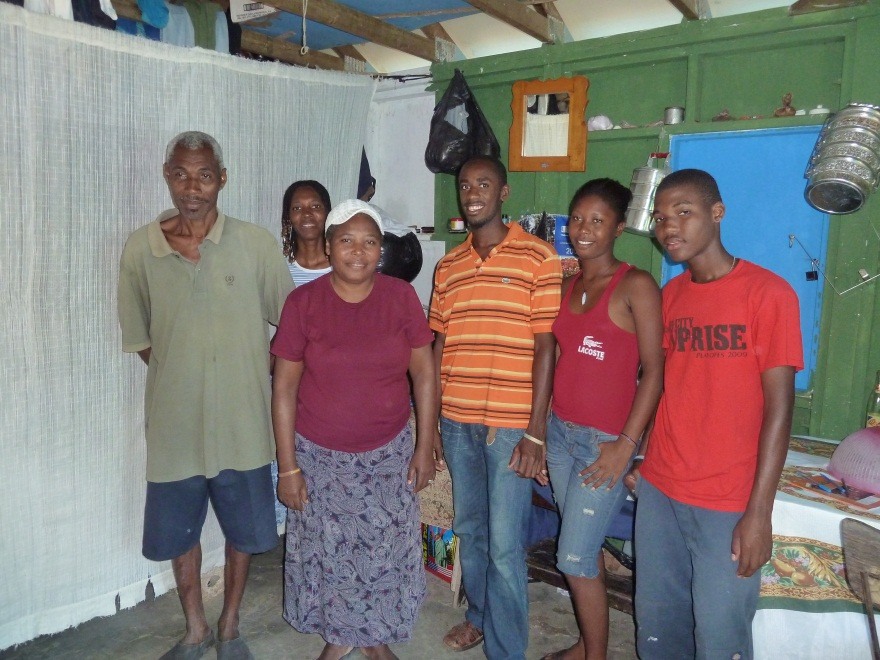 A family in Jacmel in their new home, one of 7,500 built as part of the Canadian Red Cross shelter project that was completed last spring.