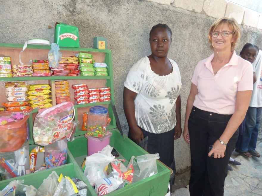 Through a Red Cross grant program this Haitian woman, here with Sue Phillips, Western Canada, started a business to support her family.