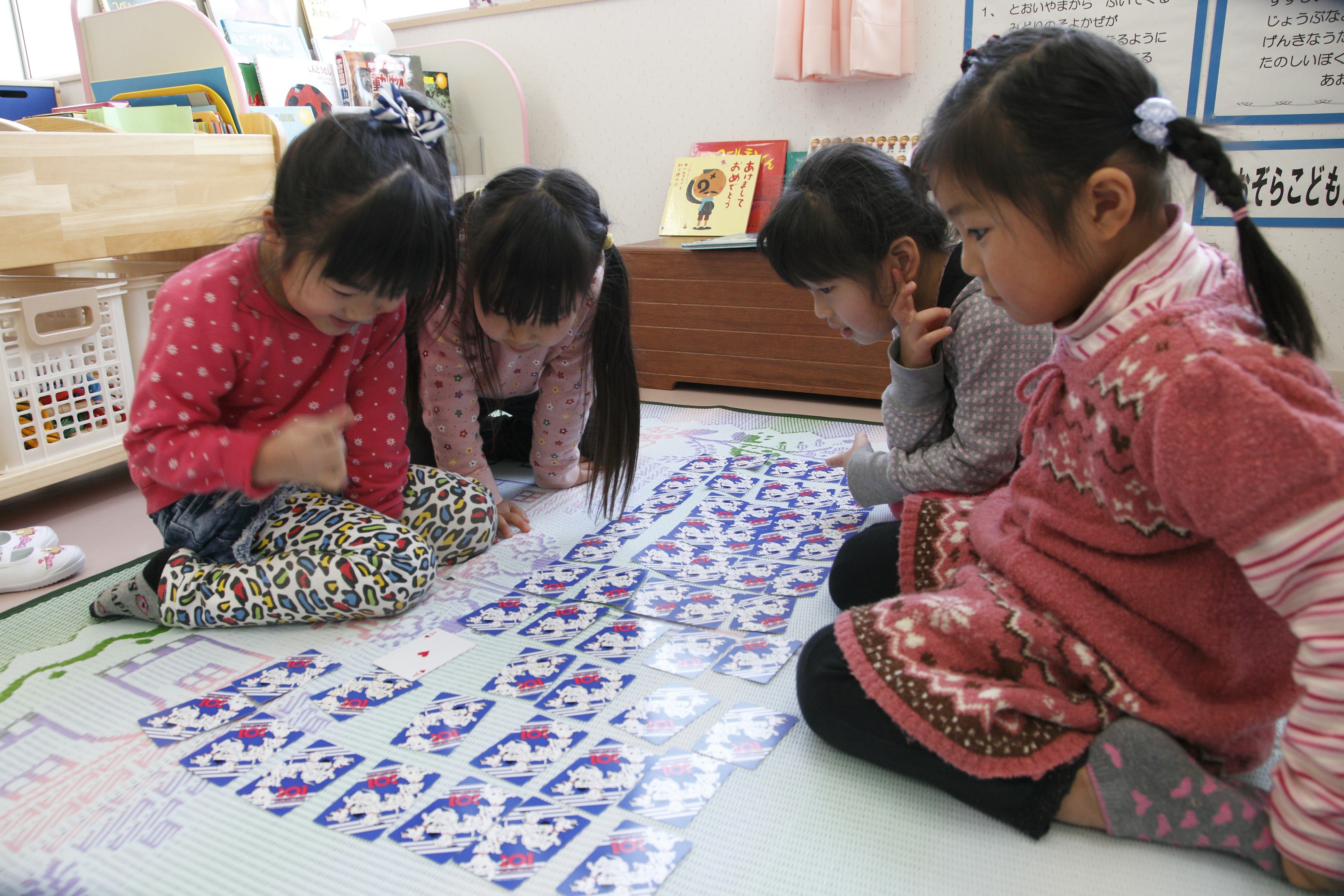 Children unable to return to their homes due to high radiation levels play in the temporary kindergarten supported by the Japanese Red Cross.