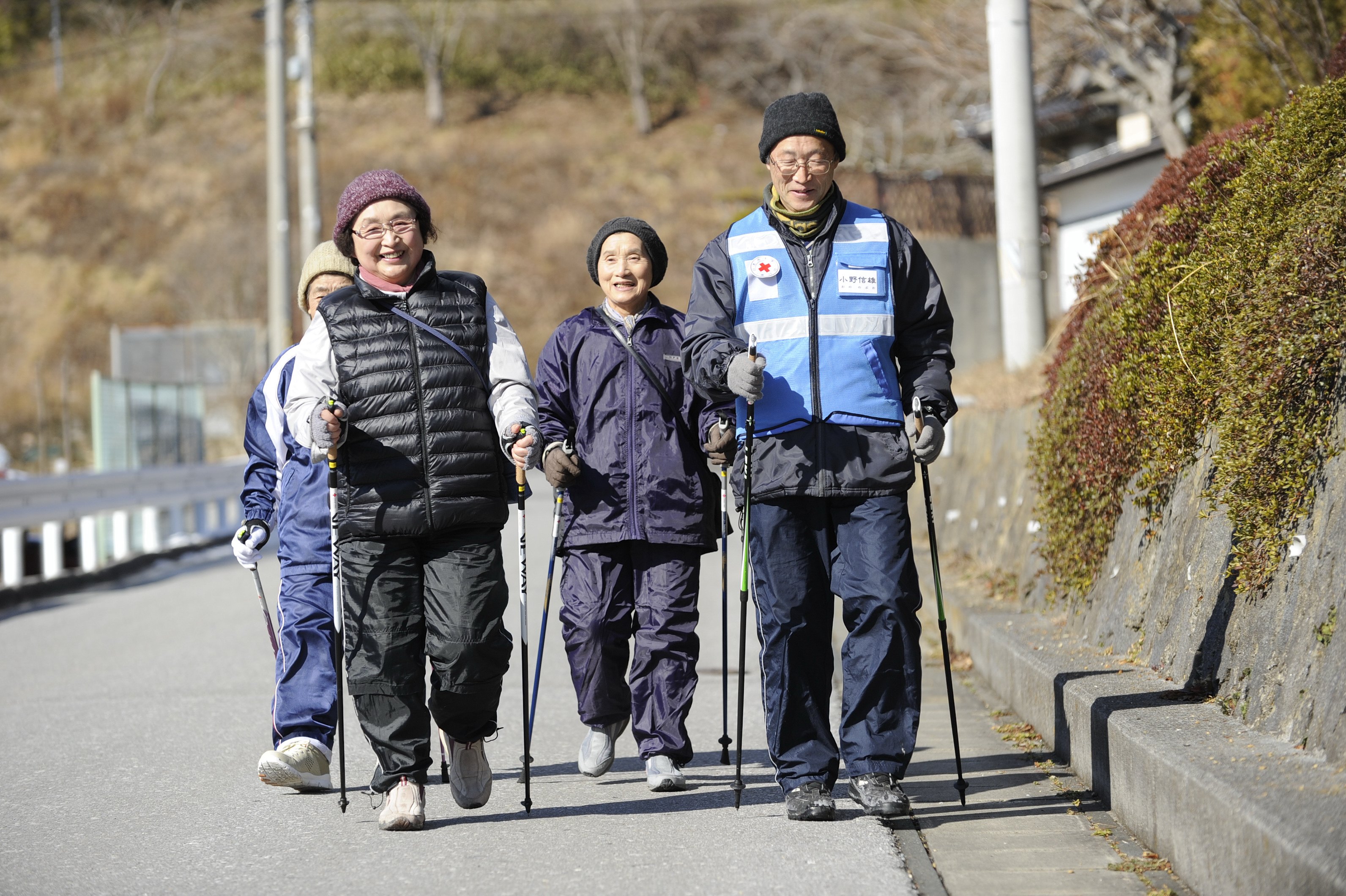Nordic walking is one of the activities organized by Japanese Red Cross volunteers for elderly inhabitants of prefabricated temporary communities.