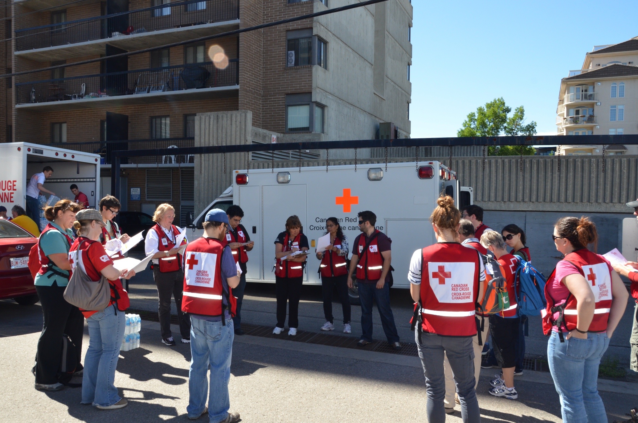 Red Cross volunteers receive their assignments