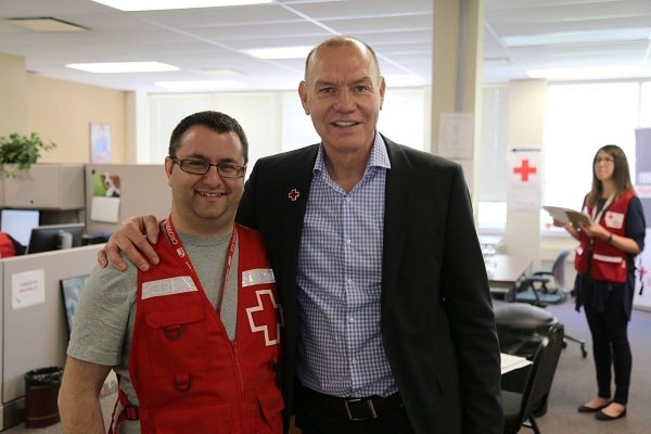 Volunteer Elie Langevin with Canadian Red Cross CEO Conrad Sauve