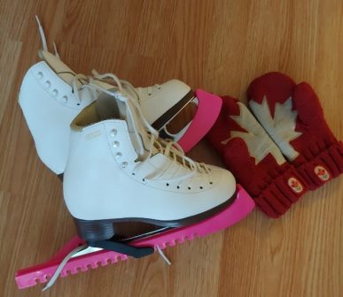 A pair of skates with a pair of mitts