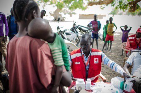 Red Cross worker in South Sudan providing health services