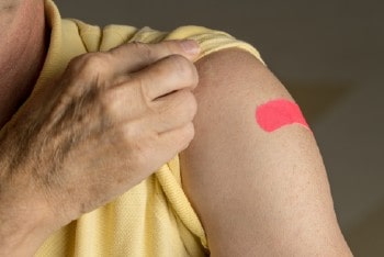 Photo of person with Band-Aid on arm