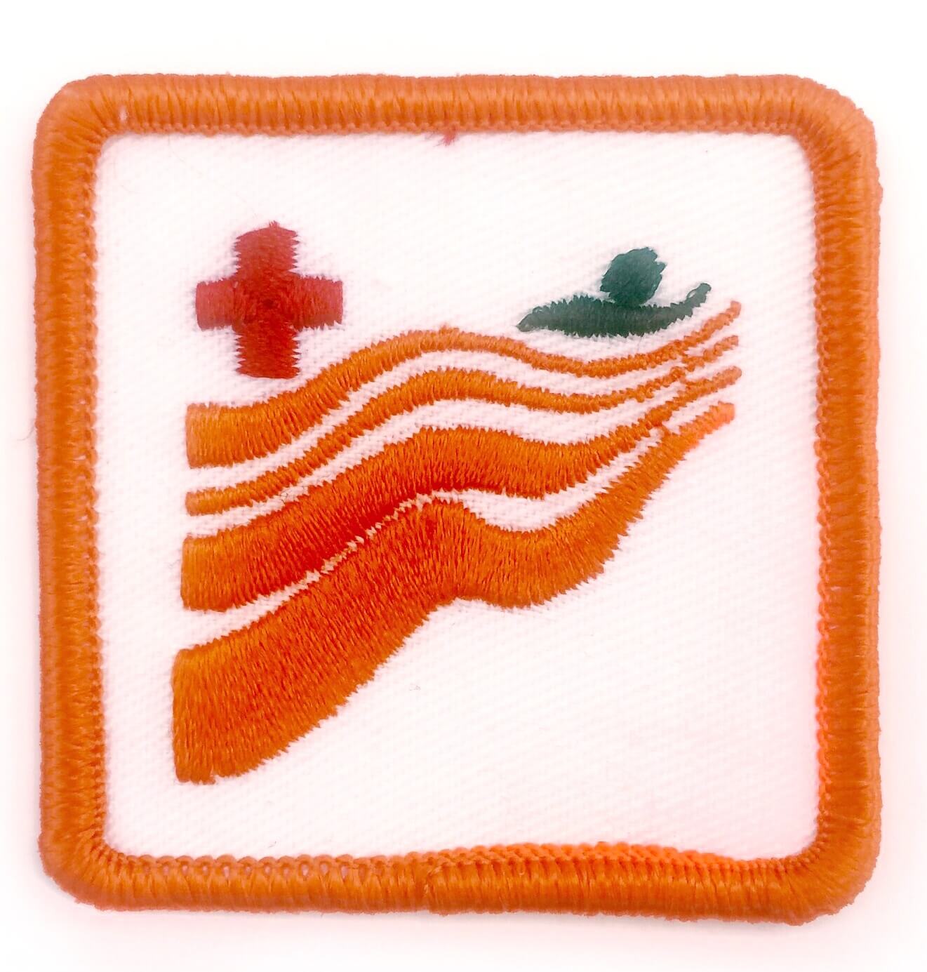 Red Cross Swimming Badge – Level Orange