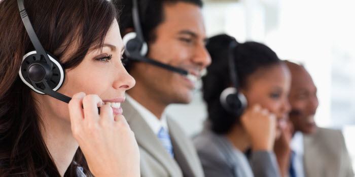 A group of people working at a call centre doing telefundraising
