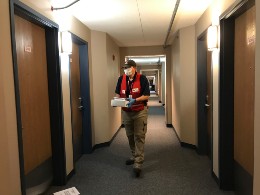 Man delivering package in hotel