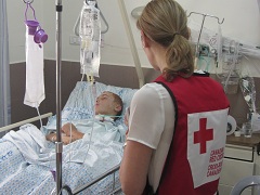 Canadian Red Cross worker visits a teenage boy in hospital following the Gaza crisis