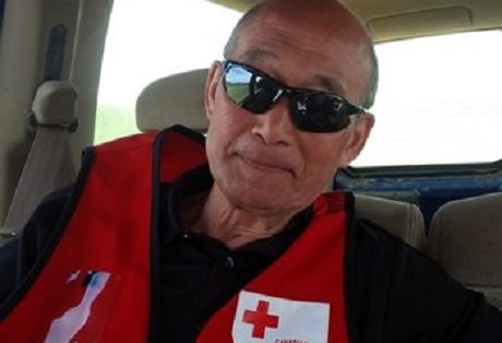 Ted in sunglasses and Red Cross red vest