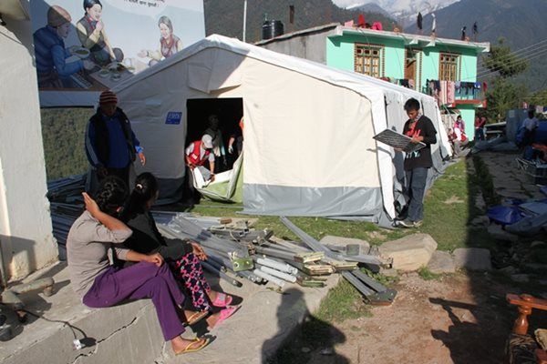 Aid workers set up tent