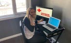 Red Cross worker working from home office