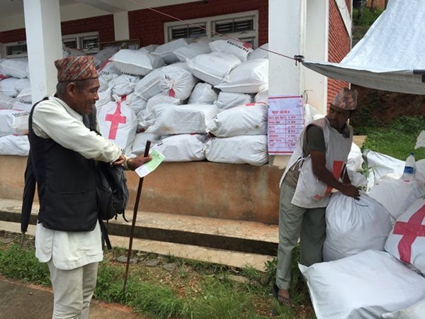 Sixty-five year old Nemawangadi Tamang picking up relief goods