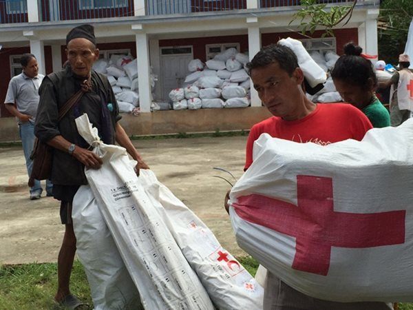 Community members from Saramthali picking up Nepal Red Cross relief items