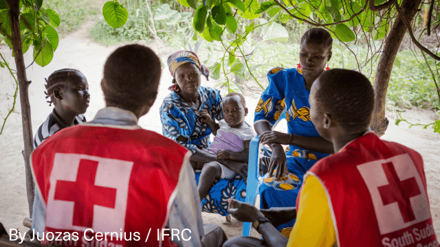 Local SSRC volunteers meet with villagers to discuss health issues in South Sudan