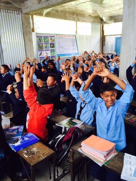 Nepalese students in their partially constructed classroom