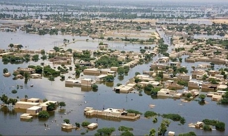 An overhead shot of extreme flooding in Pakistan with buildings nearly submerged in flooded waters