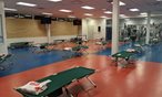 Room with Red Cross cots spread out