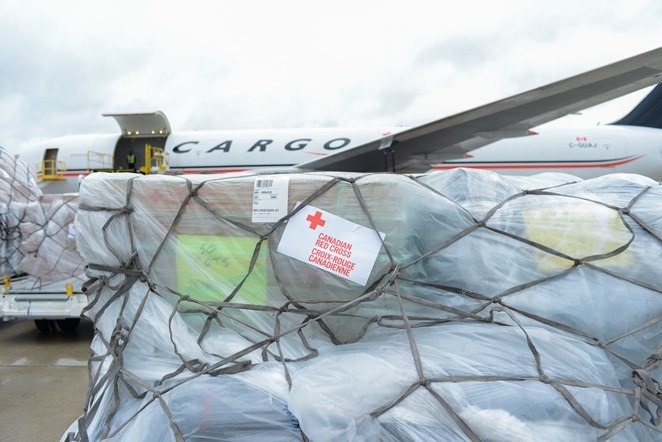 Supplies being loaded onto cargo plane
