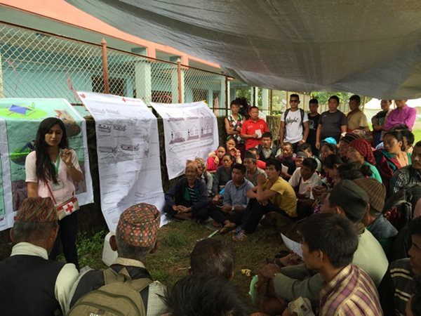Nepal Red Cross technical officer Sarita Dhungana explains the proper way to use aquatabs