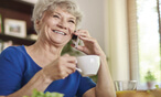 Woman holding teacup talking on phone