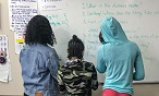 Students at white board.