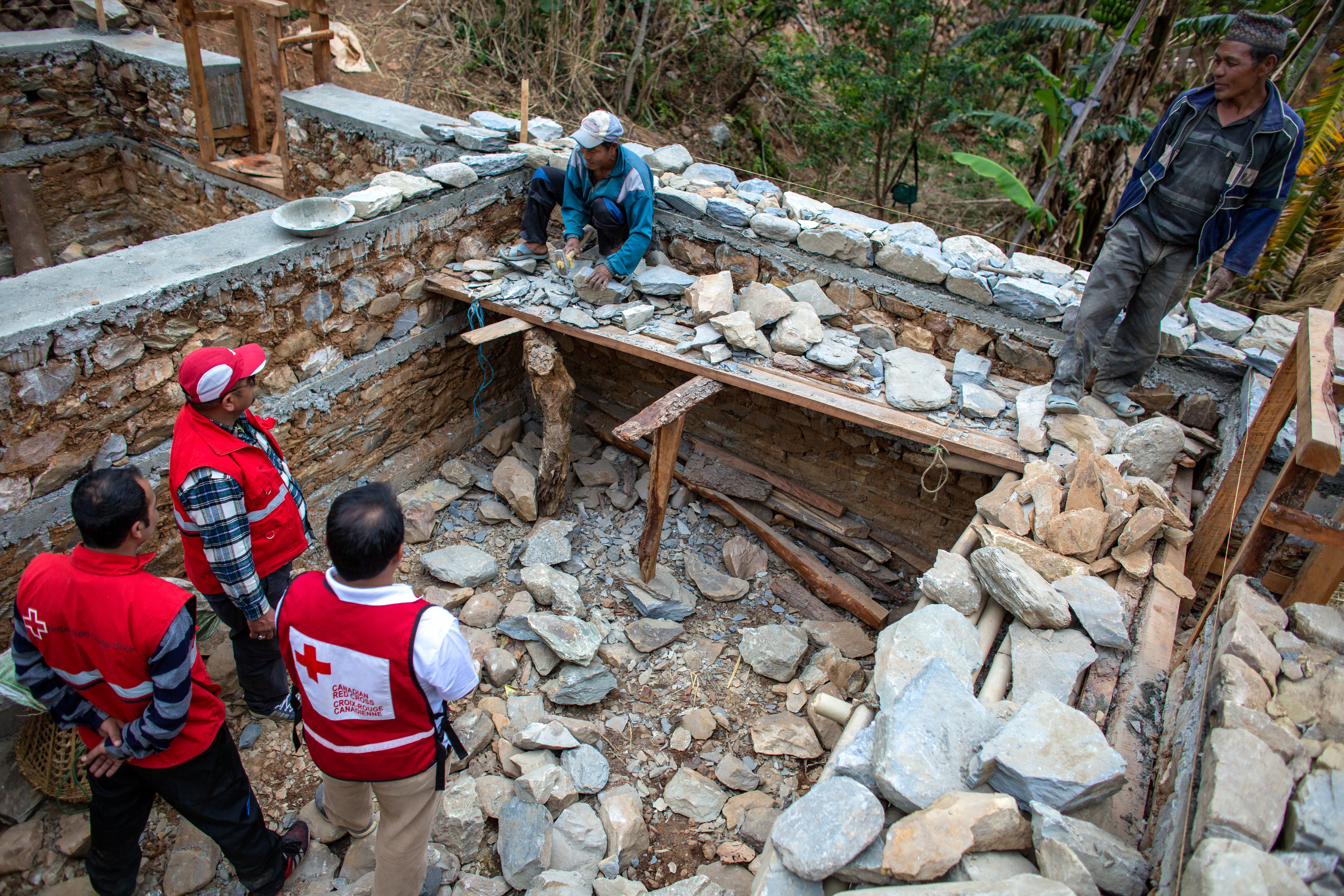 An agricultural house being rebuilt with the help of the Red Cross.