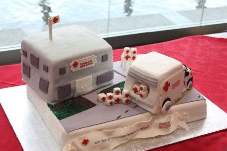 Cake made to look like Red Cross vehicles