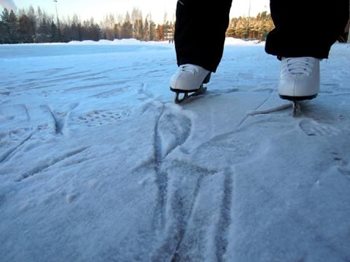 A pair of skates on frozen water