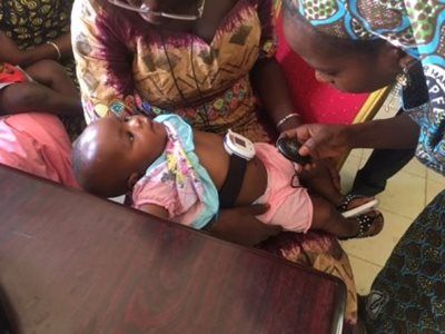 A baby gets a health check in Mali