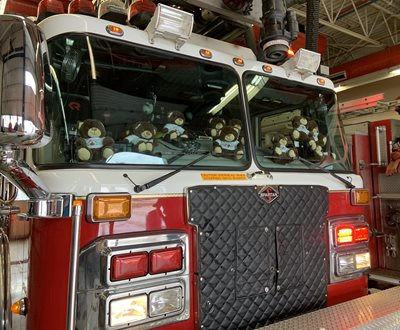 Red Cross teddy bears in a fire truck