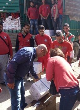 Distributing aid to those still in the besieged city
