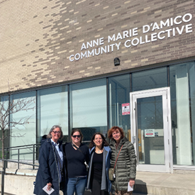 A group of Tiffany Circle members stand outside the Anne Marie D’Amico community collective centre in North York, Ontario