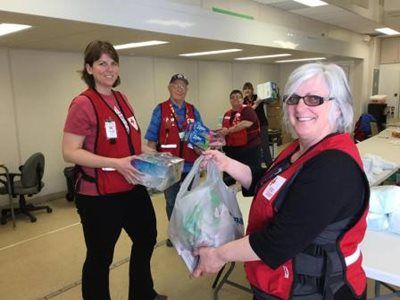 Red Cross volunteers with essential items for distribution