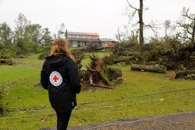 Red cross worker in area damaged by tornado