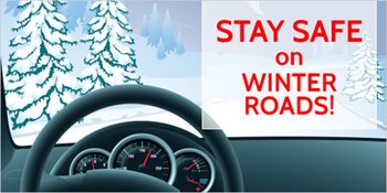 Behind a steering wheel on a snowy day. Text reads stay safe on winter roads.