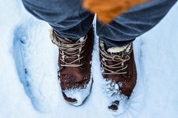 A pair of boots in snow