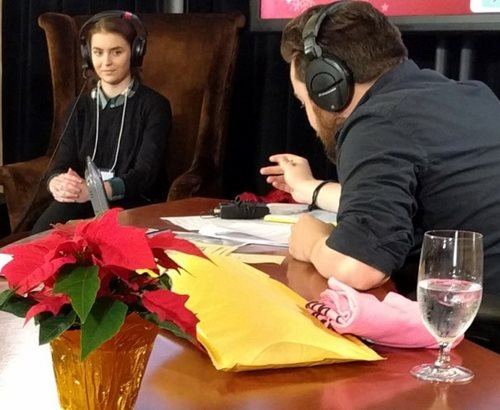 Emma McGaffney tells her story to radio host Justin “Drex” Wilcomes during CKNW Orphans’ Fund Pledge Day in Vancouver
