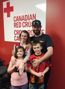 Red Cross caseworker Tiffany Whitford with her family