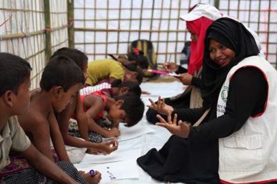 Red Crescent workers do activities with children