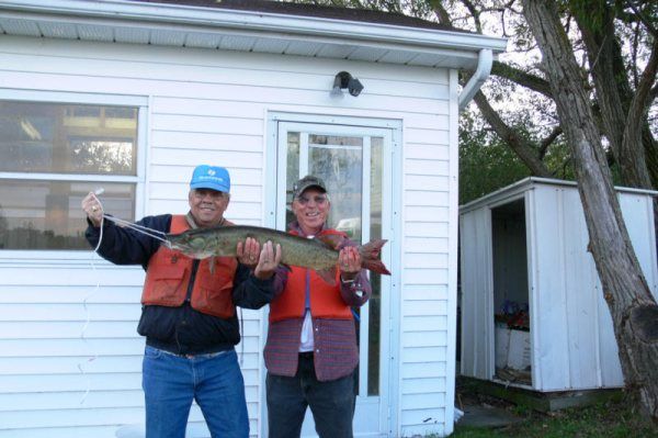 Karen's dad in the blue hat showing off his big catch on Rice Lake