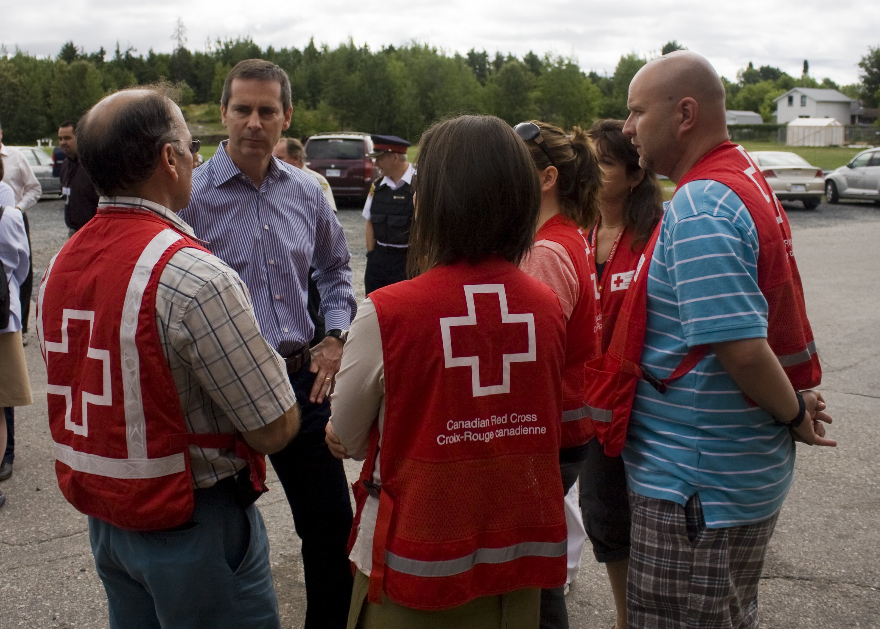 Ontario Premier Dalton McGuinty speaks with Red Cross volunteers in Dryden, ON