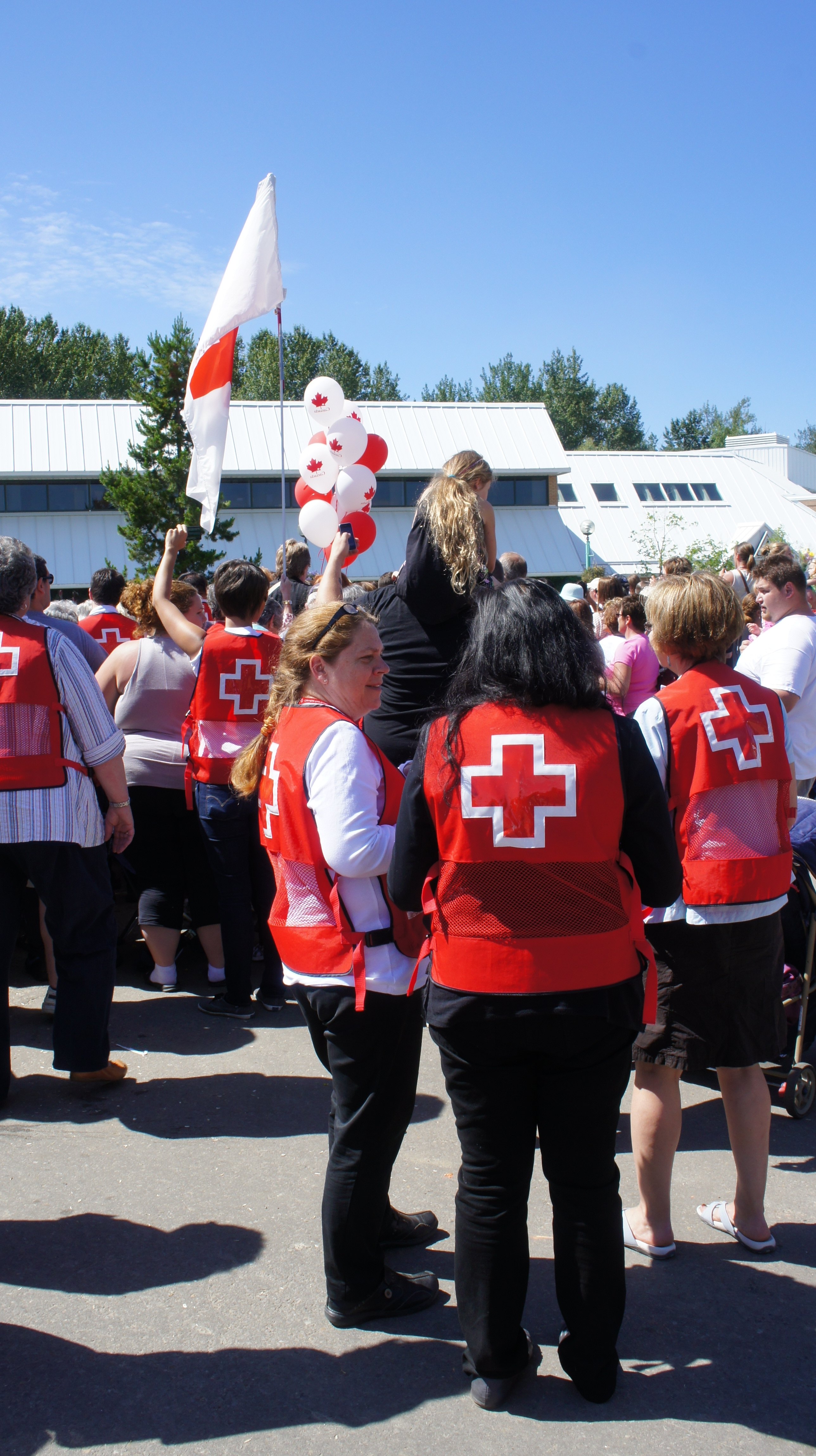 Red Cross volunteers await the royal couple.