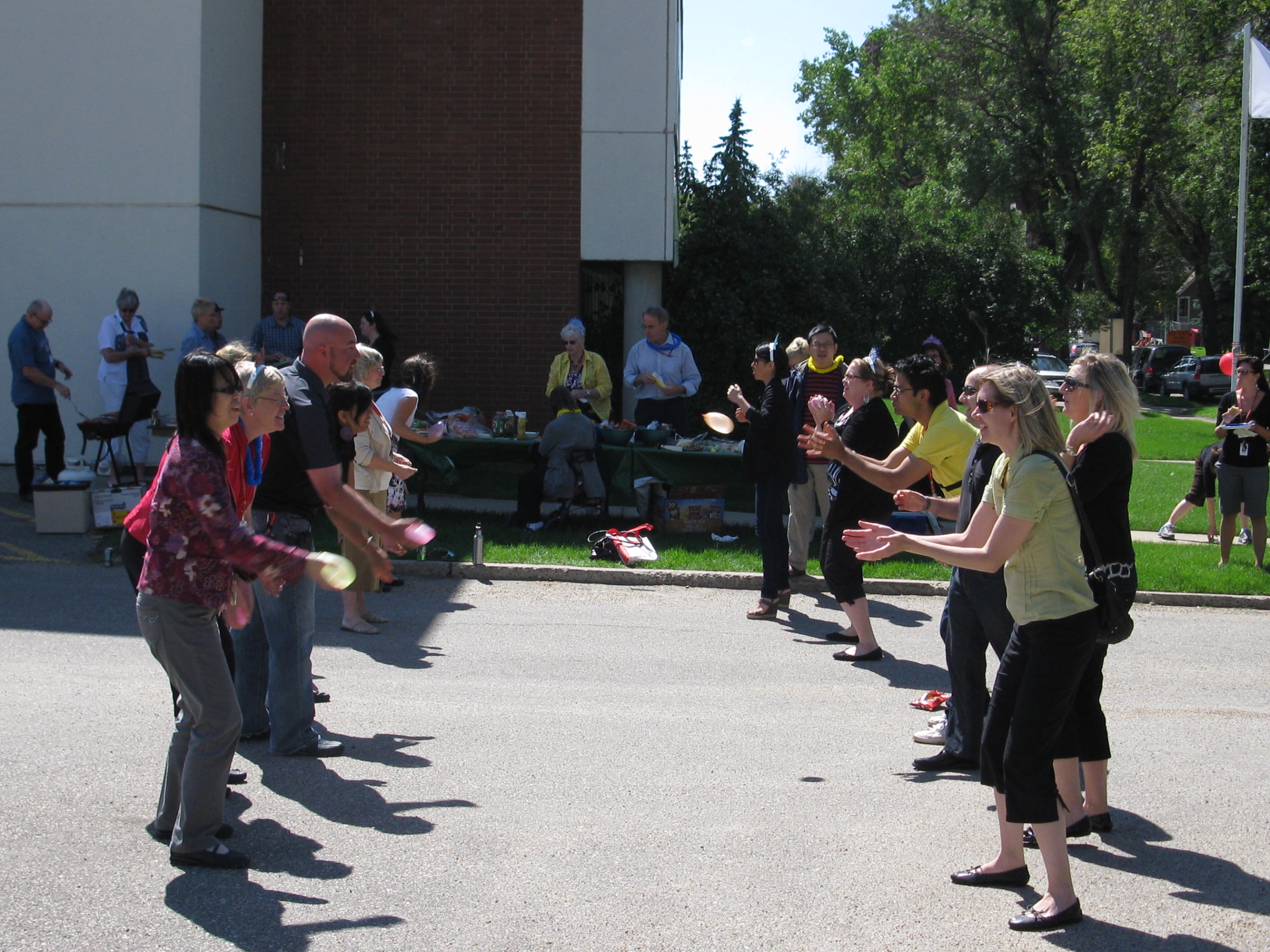 Competitors try to stay dry (mostly to no avail) for the water balloon toss, one of many fun-filled activities on hand at the appreciation BBQ held in Edmonton.