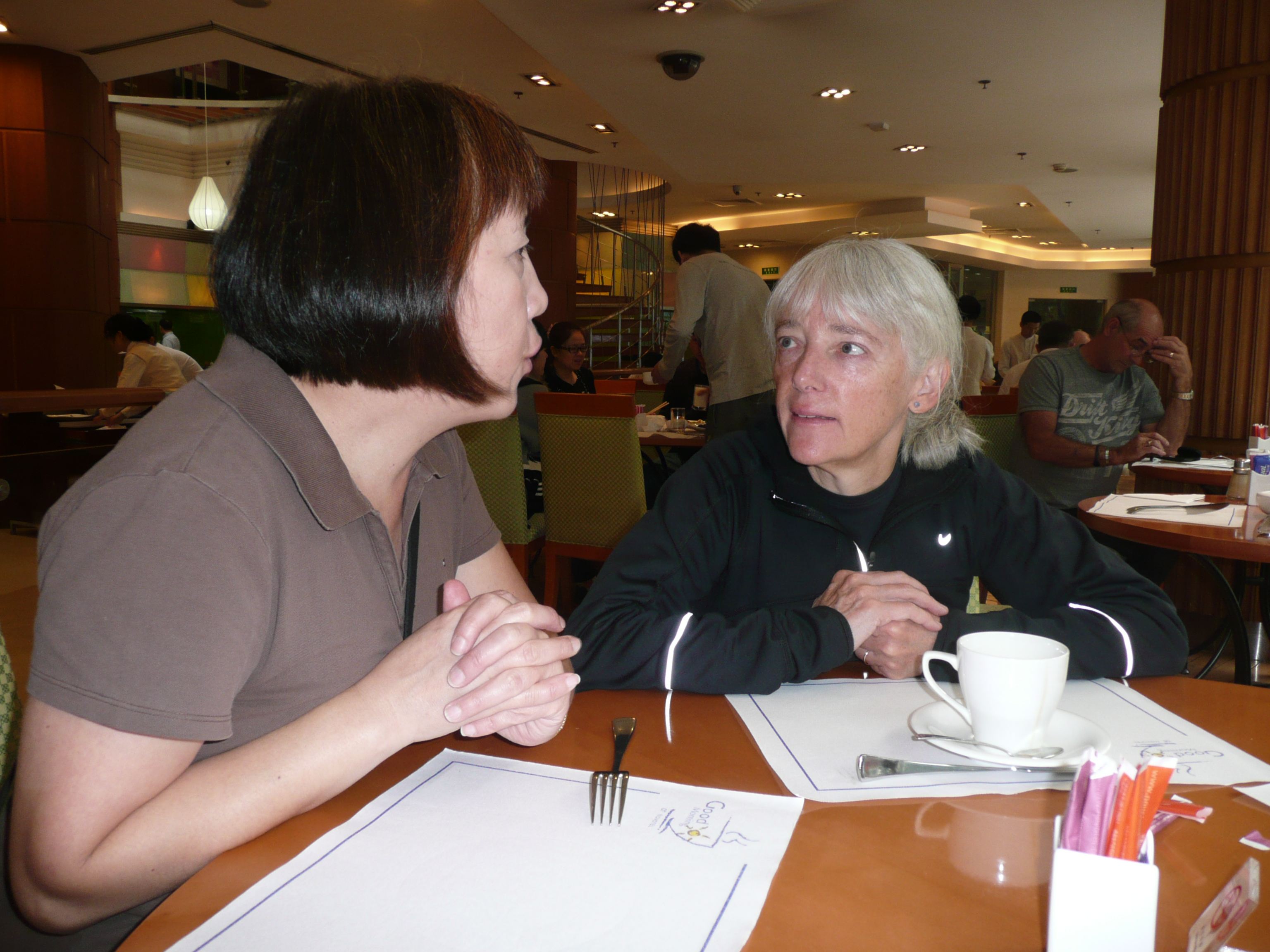 Yunhong Zhang (left) and Kimberley Nemrava (right) chat over a meal.