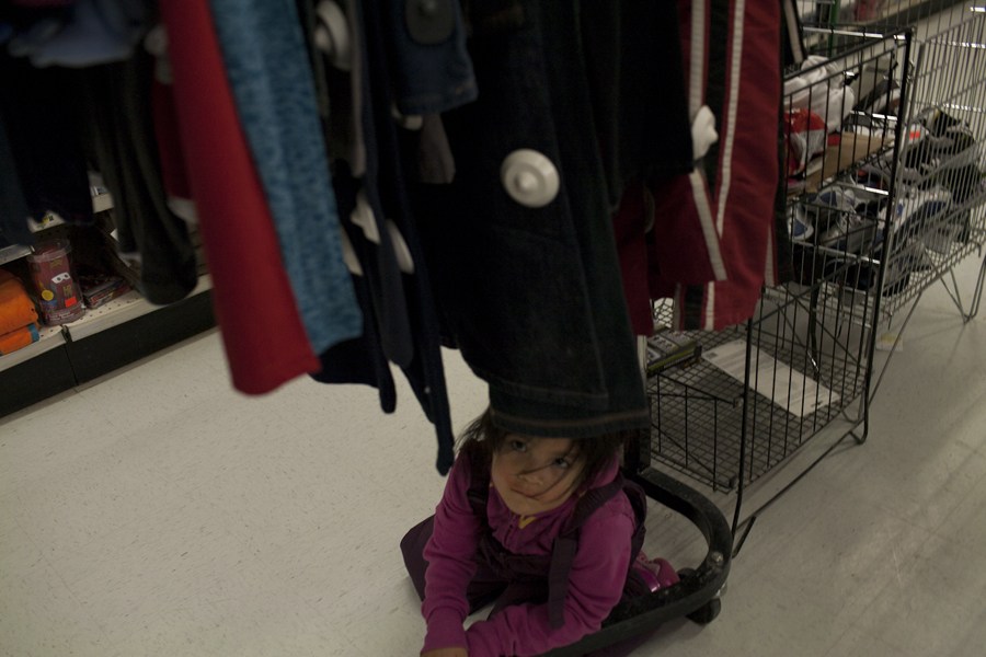 A little girl hiding out in the Northern Store where many supplies can be purchased