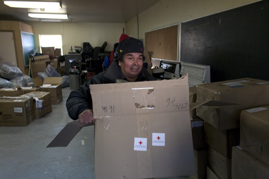 The local community is helping the Red Cross to distribute supplies